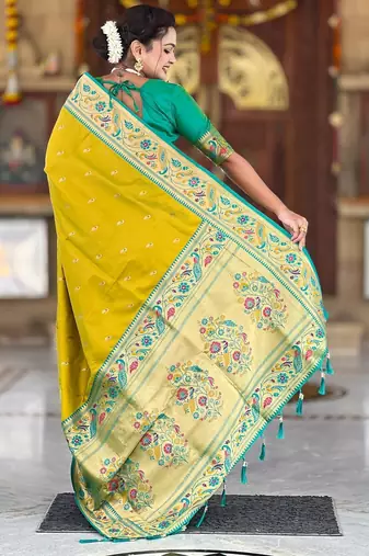 Green elegant art silk woven saree with rich zari border