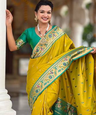 Green elegant art silk woven saree with rich zari border 3
