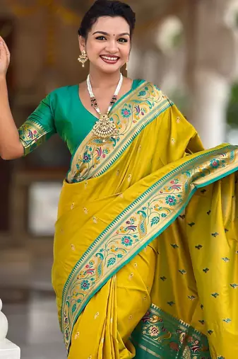 Green elegant art silk woven saree with rich zari border