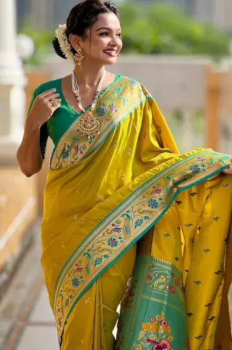 Green elegant art silk woven saree with rich zari border