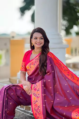 Wine elegant art silk woven saree with rich zari border