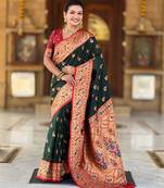 Green elegant art silk woven saree with rich zari border