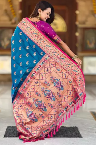 Turquoise elegant art silk woven saree with rich zari border