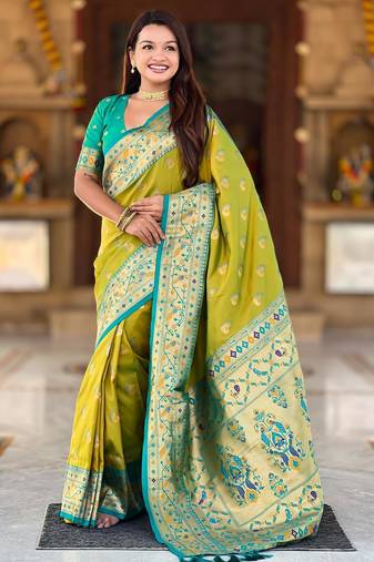 Green elegant art silk woven saree with rich zari border