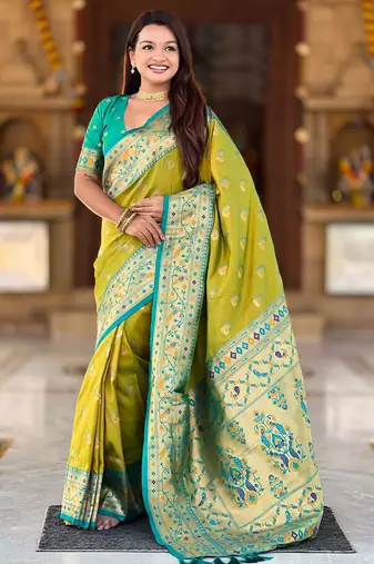 Green elegant art silk woven saree with rich zari border