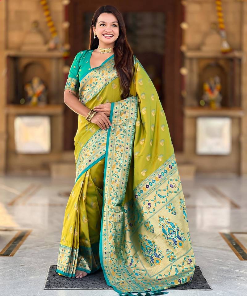 Green elegant art silk woven saree with rich zari border