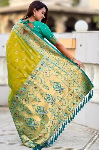Green elegant art silk woven saree with rich zari border