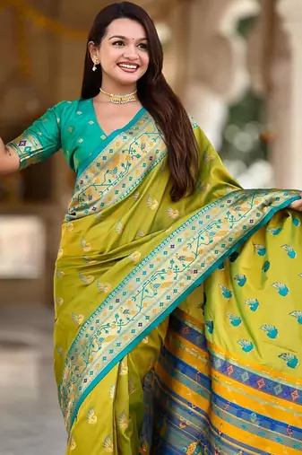 Green elegant art silk woven saree with rich zari border