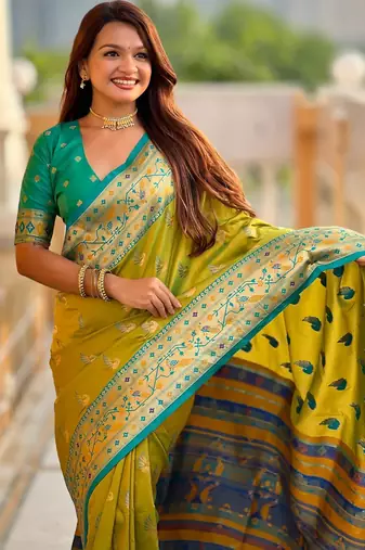 Green elegant art silk woven saree with rich zari border