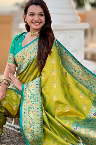 Green elegant art silk woven saree with rich zari border