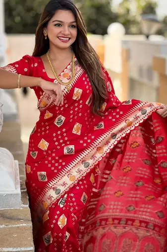 Red elegant art silk woven saree with rich zari border