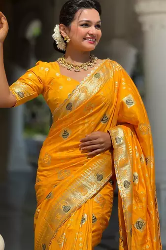 Yellow elegant art silk woven saree with rich zari border