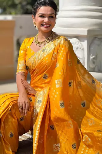 Yellow elegant art silk woven saree with rich zari border