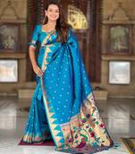 Turquoise elegant art silk woven saree with rich zari border