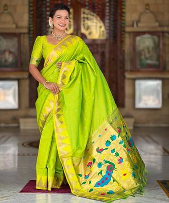 Green elegant art silk woven saree with rich zari border 1