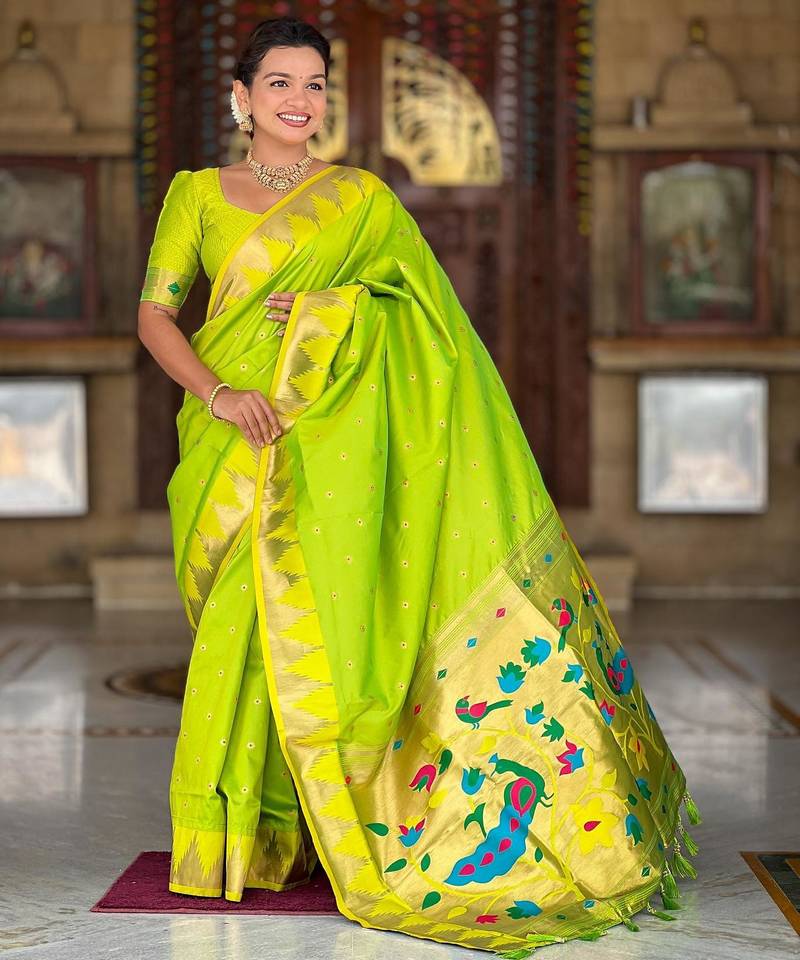 Green elegant art silk woven saree with rich zari border