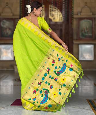 Green elegant art silk woven saree with rich zari border 2