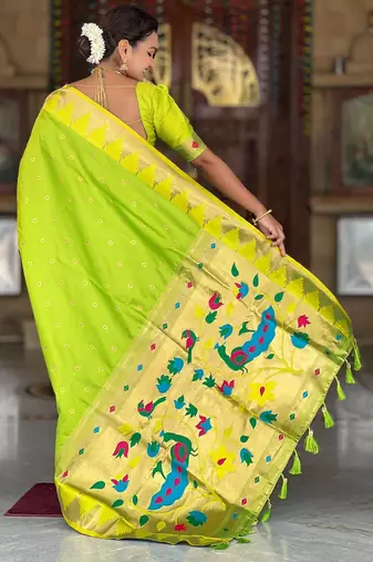 Green elegant art silk woven saree with rich zari border