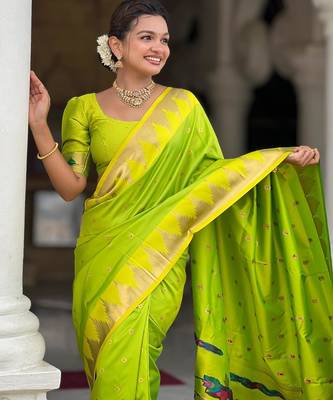 Green elegant art silk woven saree with rich zari border 3