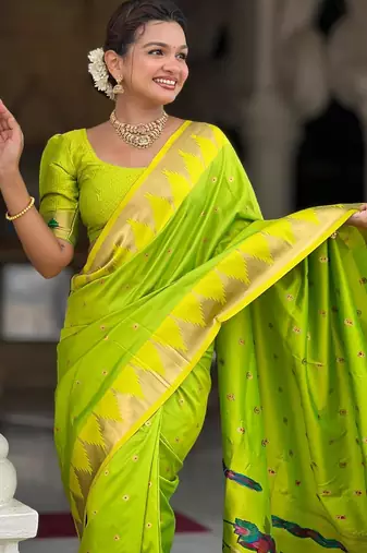 Green elegant art silk woven saree with rich zari border