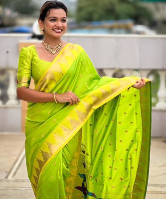 Green elegant art silk woven saree with rich zari border 4