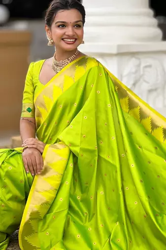 Green elegant art silk woven saree with rich zari border