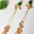Gold alloy inayata fusion earrings  emerald