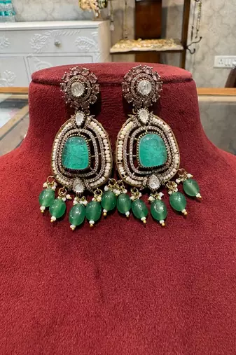 Gold alloy ikshitha kundan earrings