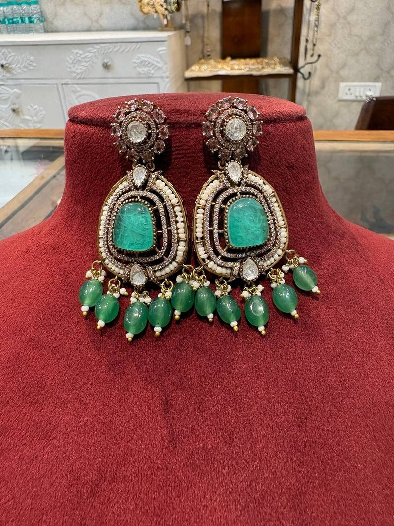 Gold alloy ikshitha kundan earrings