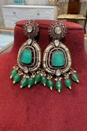 Gold alloy ikshitha kundan earrings