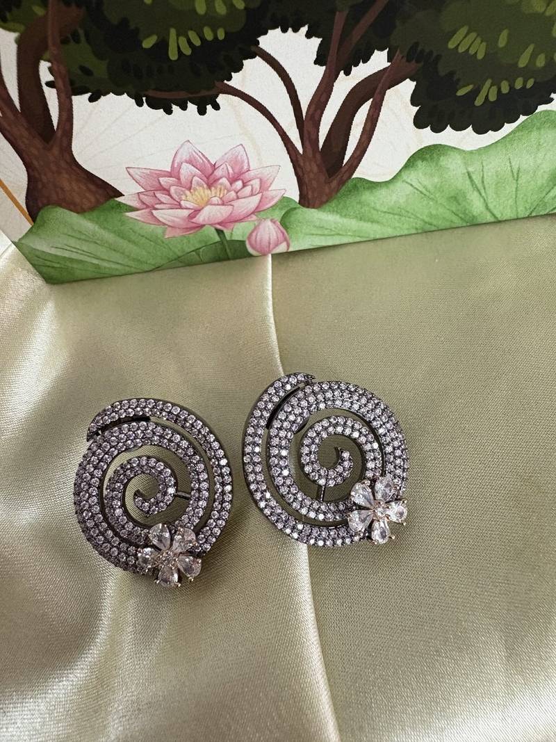 Gold alloy pansy stud earrings