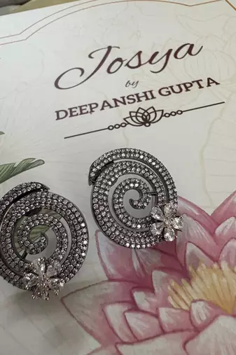 Gold alloy pansy stud earrings