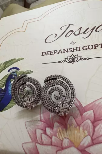 Gold alloy pansy stud earrings