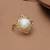 white brass ring with pearl halo floral work