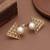 white brass ring with pearl geometric triangle work
