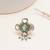 green alloy ring with kundan pearl floral work