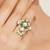 green alloy ring with kundan pearl floral work