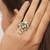green alloy ring with kundan pearl floral work