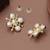 white brass earrings with pearl geometric work