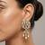 white alloy earrings with kundan pearl layered chandelier