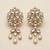 white alloy earrings with kundan pearl layered chandelier
