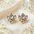 white alloy studs with kundan lotus floral work
