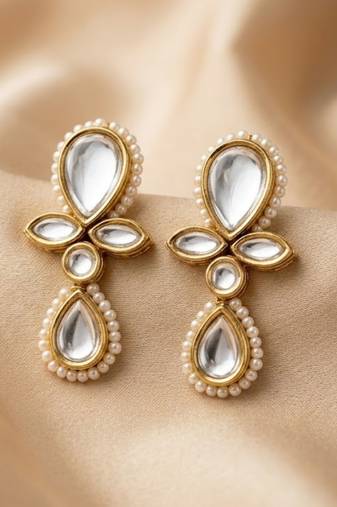 white alloy earrings with kundan pearl drop floral work