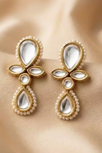 white alloy earrings with kundan pearl drop floral work
