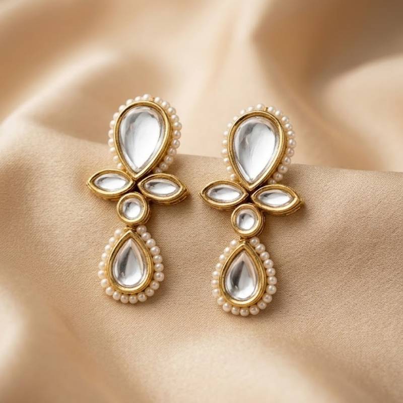 white alloy earrings with kundan pearl drop floral work