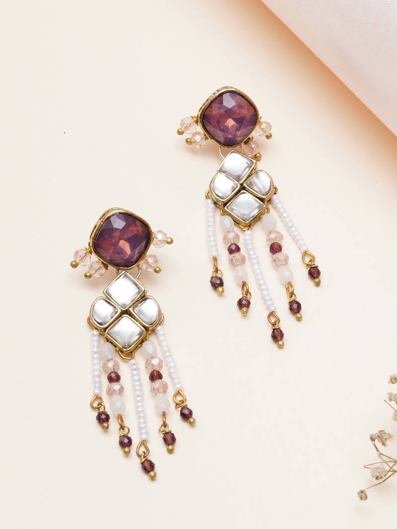 purple alloy earrings with kundan pearl work design