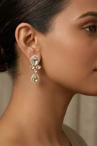 white alloy earrings with kundan pearl drop floral work