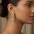 white alloy earrings with kundan pearl drop floral work