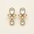 white alloy earrings with kundan pearl drop floral work