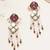 purple alloy earrings with kundan pearl work design